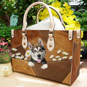 Alaskan Malamute Holding Daisy Leather Bag