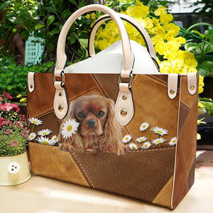 Cavalier King Charles Spaniel Holding Daisy Leather Bag