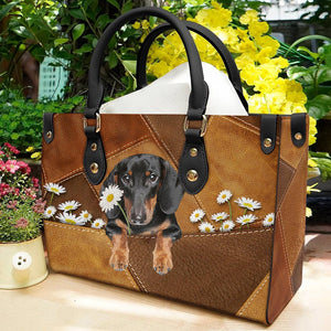 Dachshund Holding Daisy Leather Bag