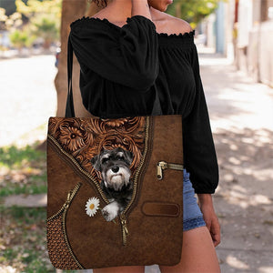 Schnauzer Holding Daisy Tote Bag