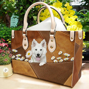 White German Shepherd Holding Daisy Leather Bag