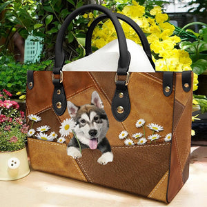 Alaskan Malamute Holding Daisy Leather Bag