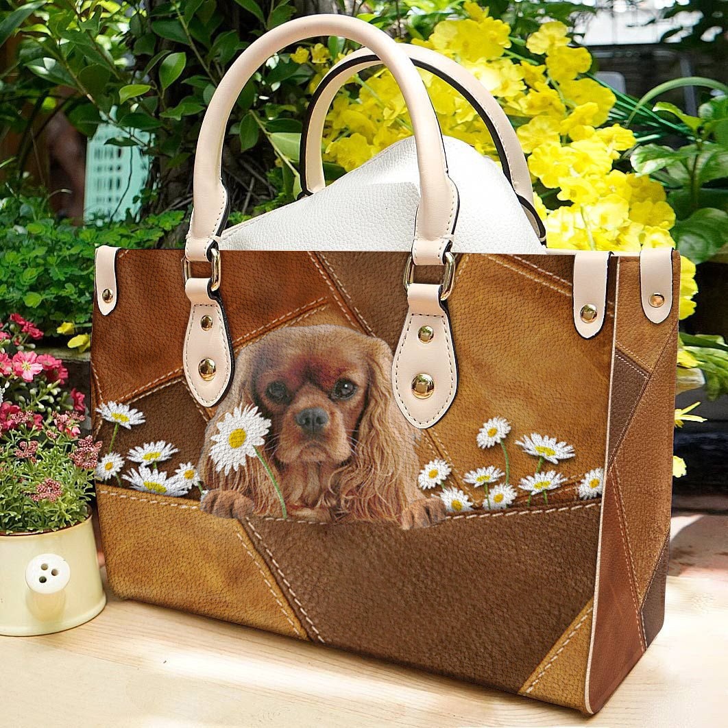 Cavalier King Charles Spaniel Holding Daisy Leather Bag