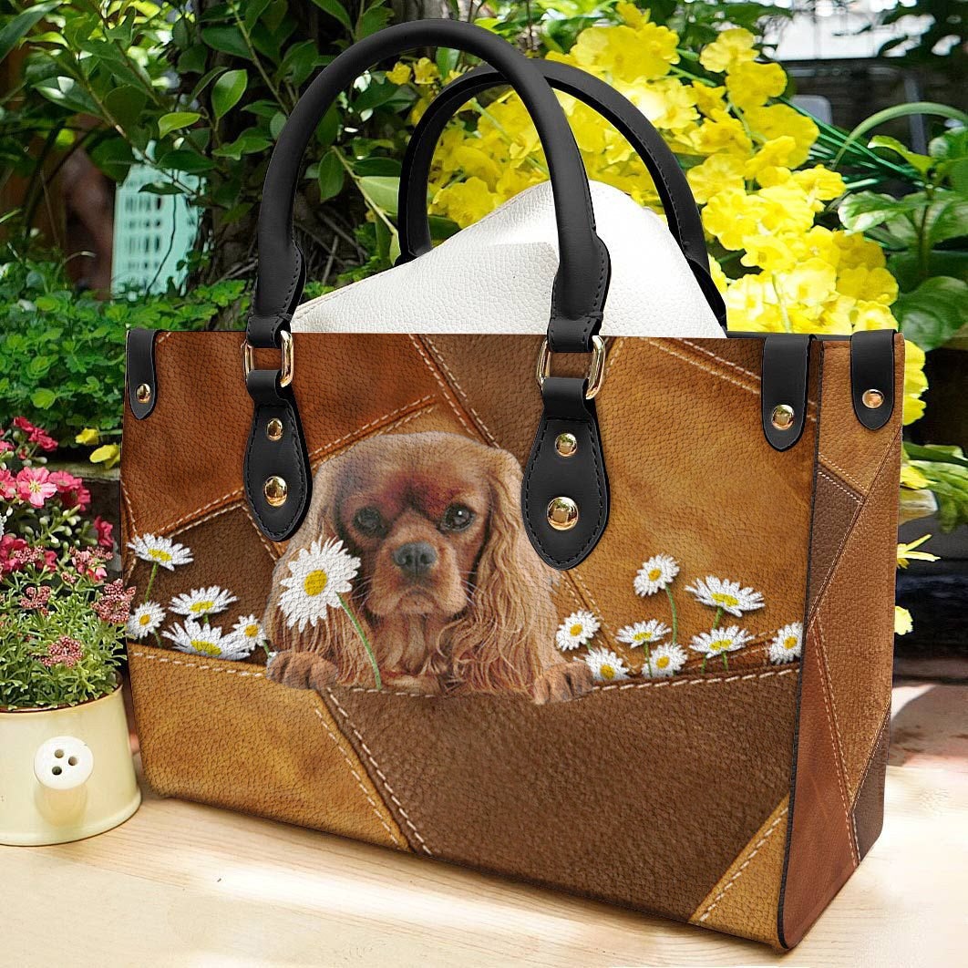 Cavalier King Charles Spaniel Holding Daisy Leather Bag