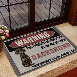 THIS PROPERTY IS PROTECTED BY HIGHLY TRAINED Dachshund Doormat