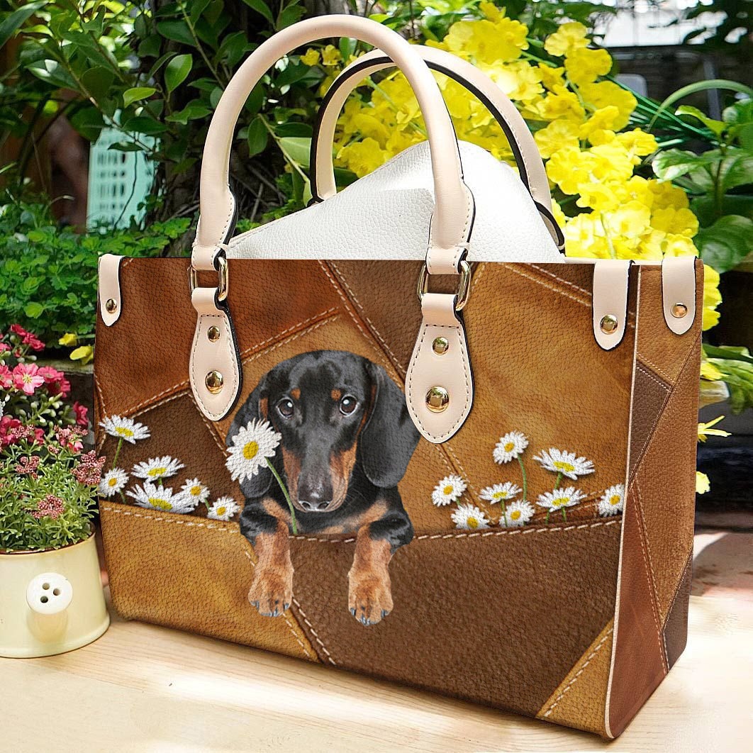 Dachshund Holding Daisy Leather Bag