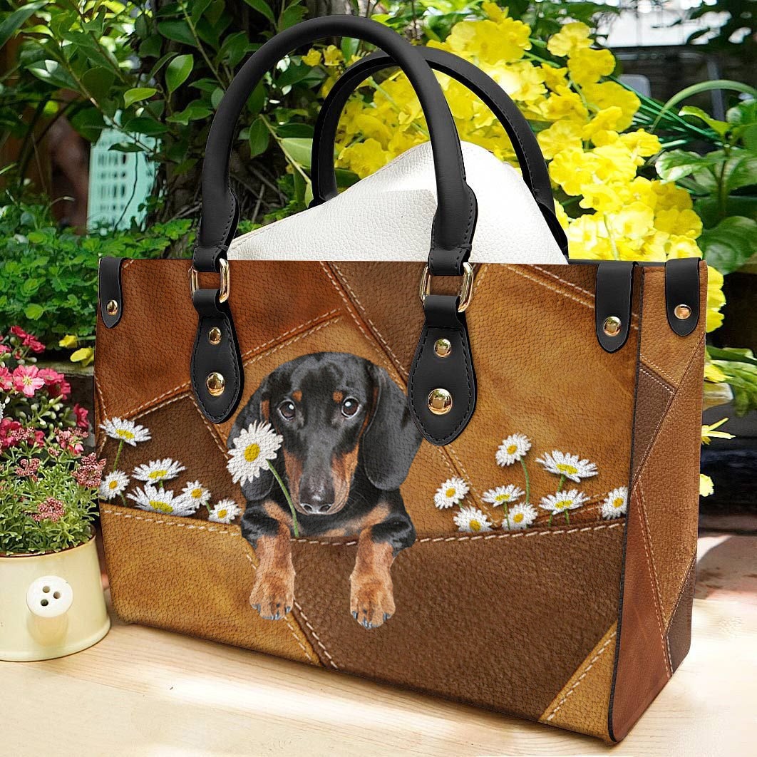 Dachshund Holding Daisy Leather Bag