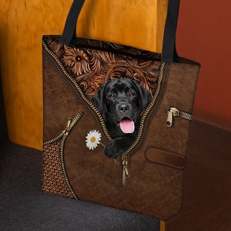 Black Labrador Retriever Holding Daisy Tote Bag