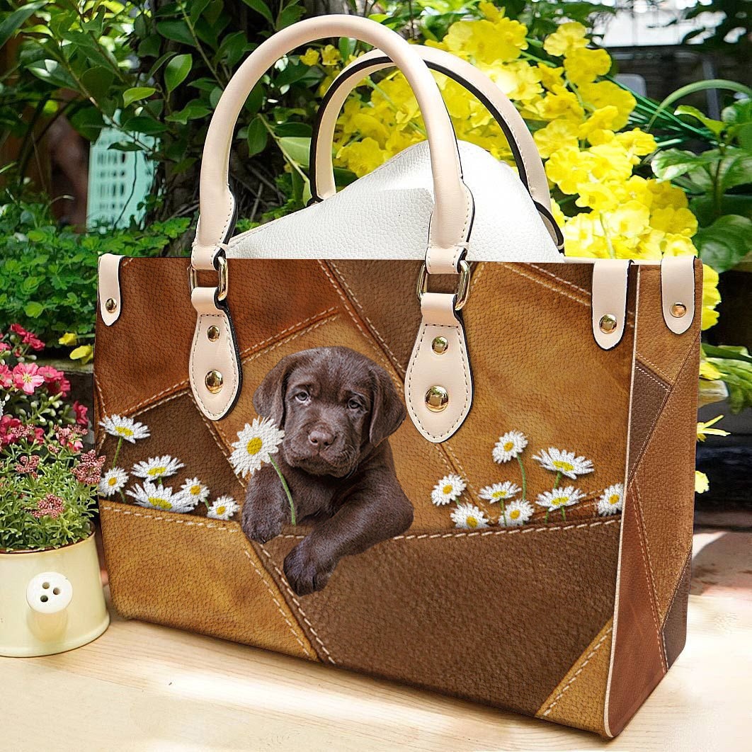 Labrador Retriever Holding Daisy Leather Bag