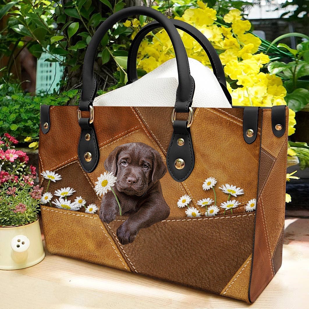 Labrador Retriever Holding Daisy Leather Bag