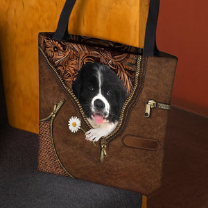 Newfoundland Holding Daisy Tote Bag