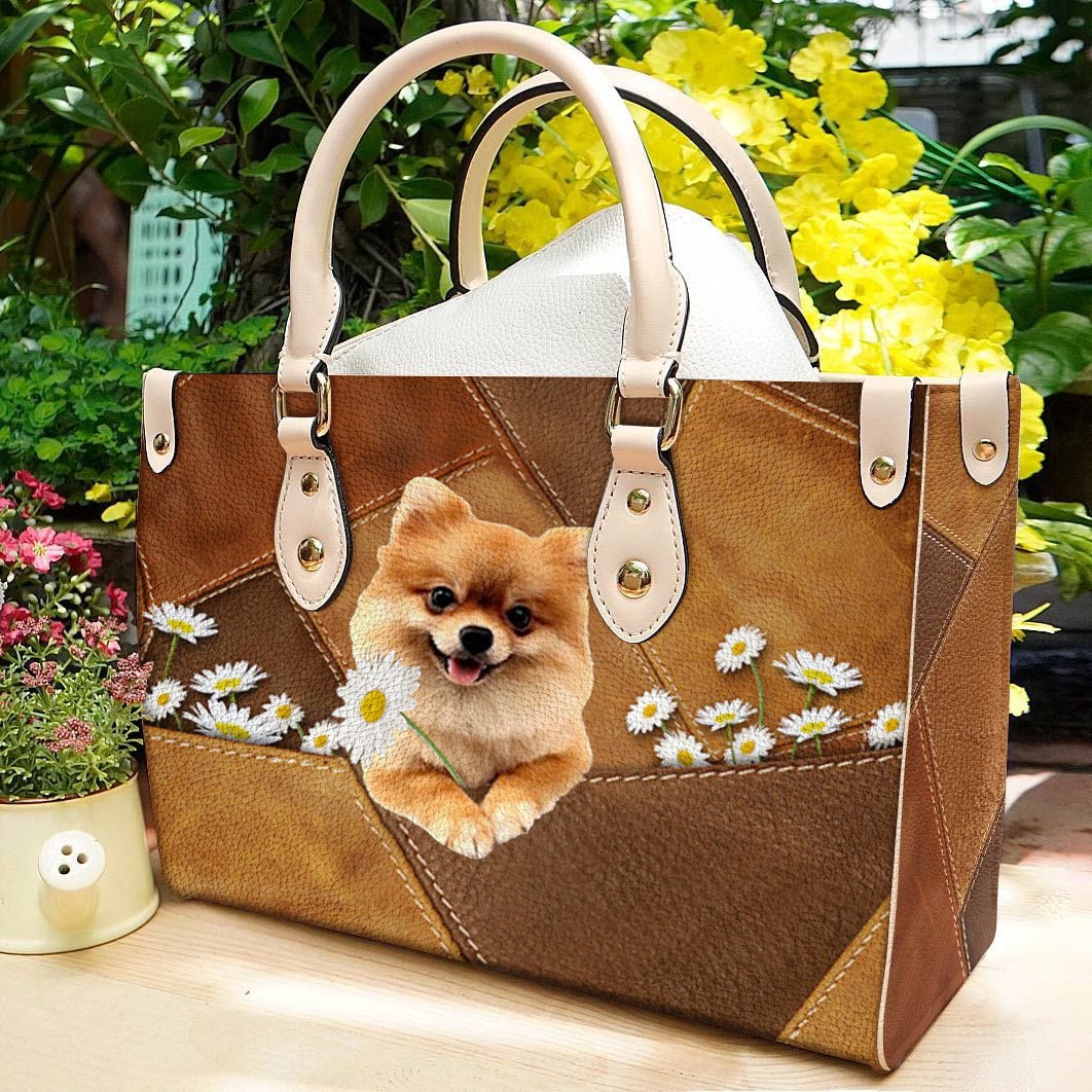 Pomeranian Holding Daisy Leather Bag