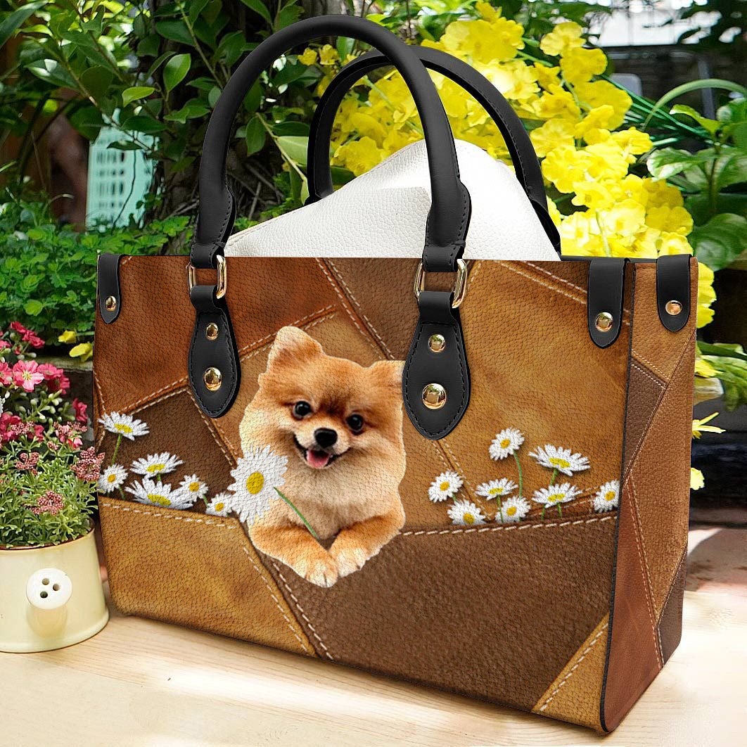 Pomeranian Holding Daisy Leather Bag