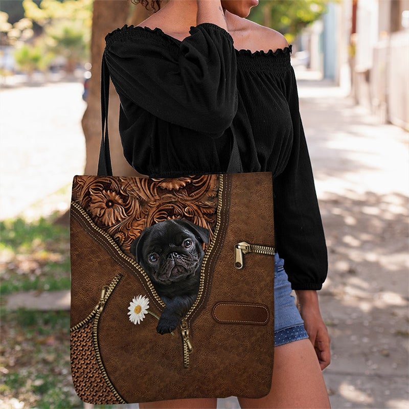 Black Pug Holding Daisy Tote Bag