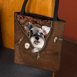 Schnauzer Holding Daisy Tote Bag