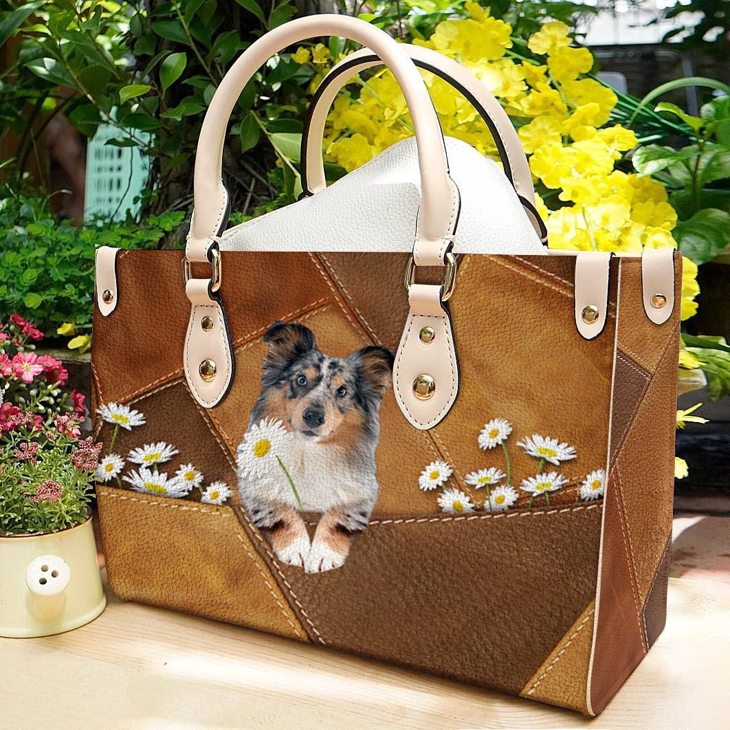 Shetland Sheepdog Holding Daisy Leather Bag