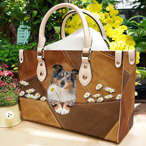 Shetland Sheepdog Holding Daisy Leather Bag