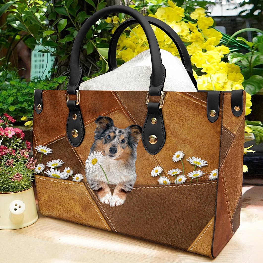 Shetland Sheepdog Holding Daisy Leather Bag