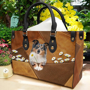 Shetland Sheepdog Holding Daisy Leather Bag