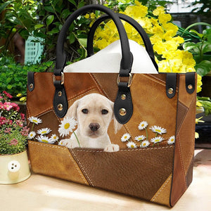 Yellow Labrador Holding Daisy Leather Bag